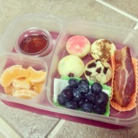 pancake muffins with pure maple syrup, bacon, blueberries, cutie orange